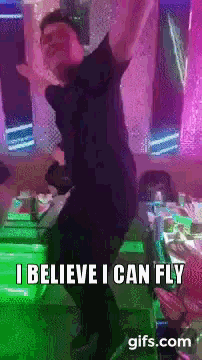 a man is dancing with the words i believe i can fly