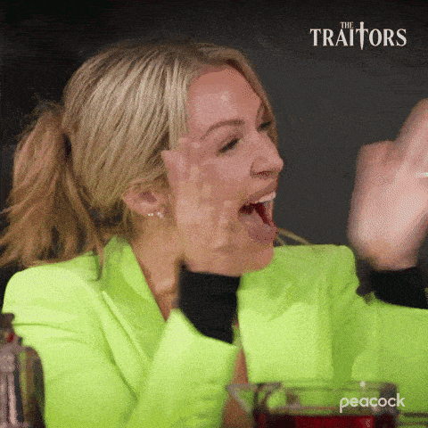 a woman in a neon green jacket is sitting at a table with her mouth open and a peacock logo in the background