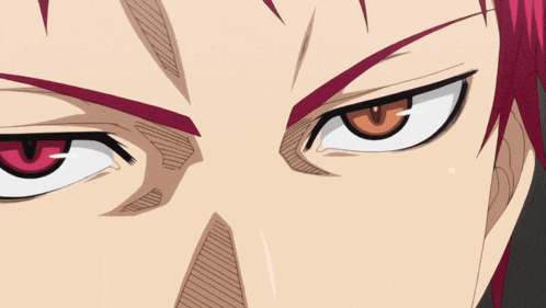 a close up of a person 's eyes with a red eye