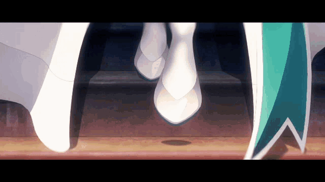 a couple of women 's feet are shown in white shoes