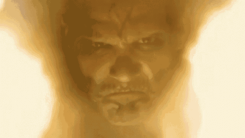 a close up of a man 's face covered in dust and smoke .