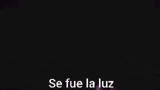 a purple light coming out of a person 's hand with the words `` se fue la luz '' written on it .