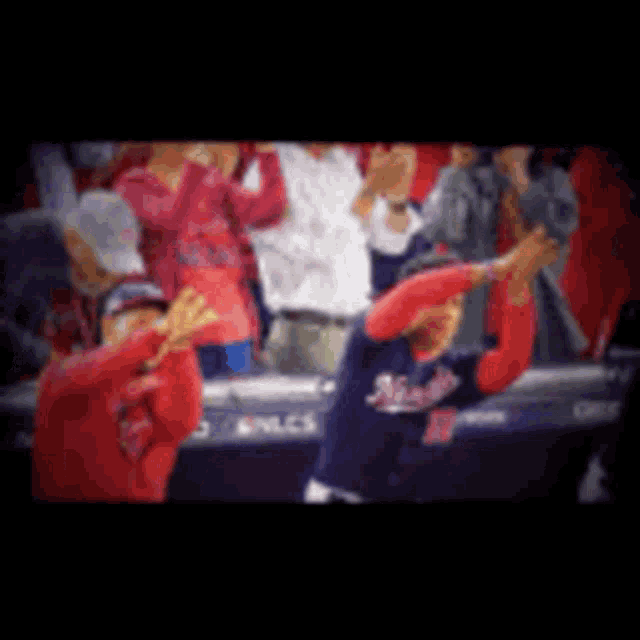 a blurred image of a baseball game with a player wearing a washington jersey