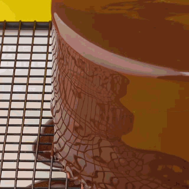 a chocolate cake sitting on a cooling rack