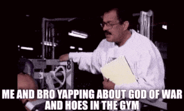 a man is talking to another man in a gym about god of war