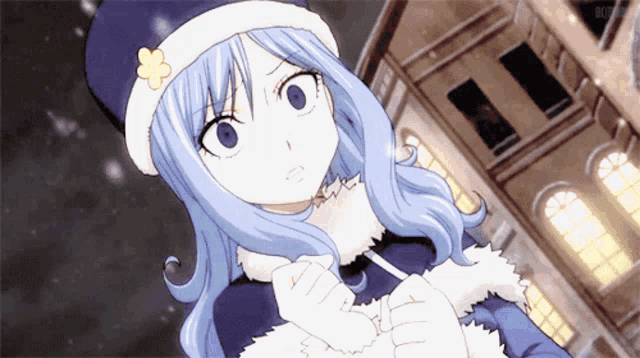 a girl with blue hair is wearing a blue hat