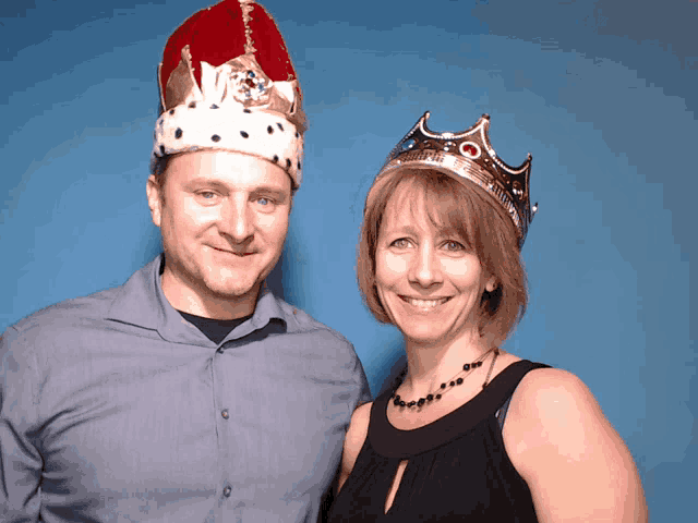 a man and a woman wearing crowns on their heads