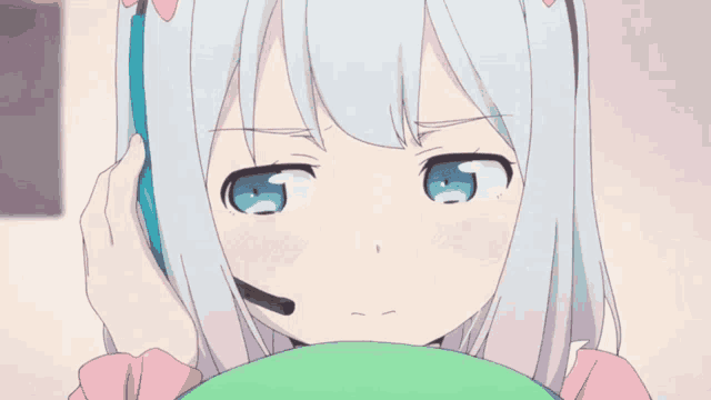 a girl with white hair and blue eyes is wearing a headset .