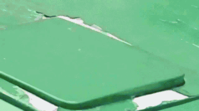 a close up of a blue object with a hole in the middle