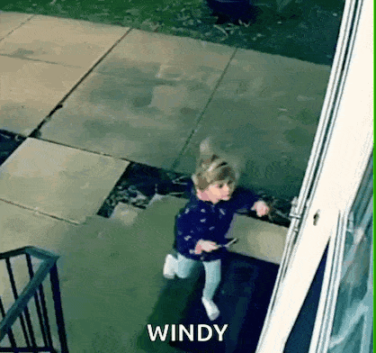 a little girl is running down the stairs with the word windy written on the bottom