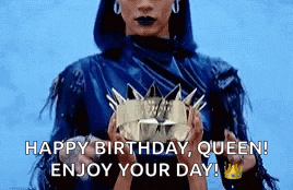 a woman is holding a crown in her hands and saying `` happy birthday queen ! enjoy your day ! ''