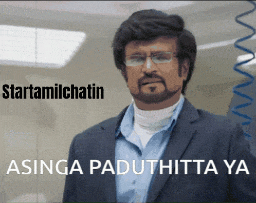 a man with glasses and a beard is standing in front of a sign that says startamilchatin