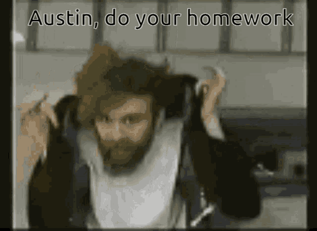 a man with a beard is talking on a phone with the words " austin do your homework " below him