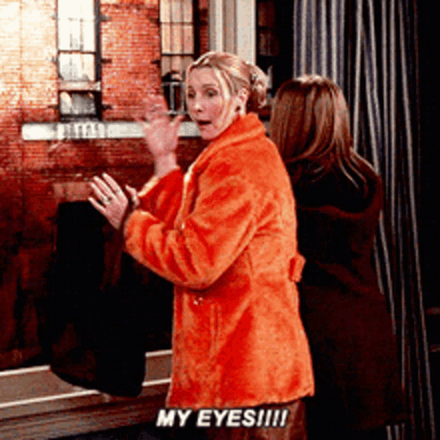a woman in an orange coat says my eyes