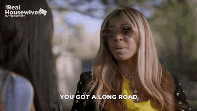 a woman says you got a long road in front of a real housewives logo