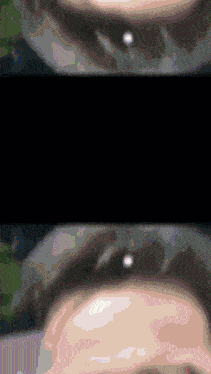 a close up of a person 's face with a drop of water coming out of it
