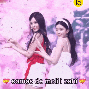 two girls are standing next to each other with the words somos de moli i zahi written below them