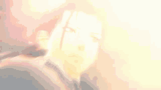 a close up of a person 's face with a serious look on his face