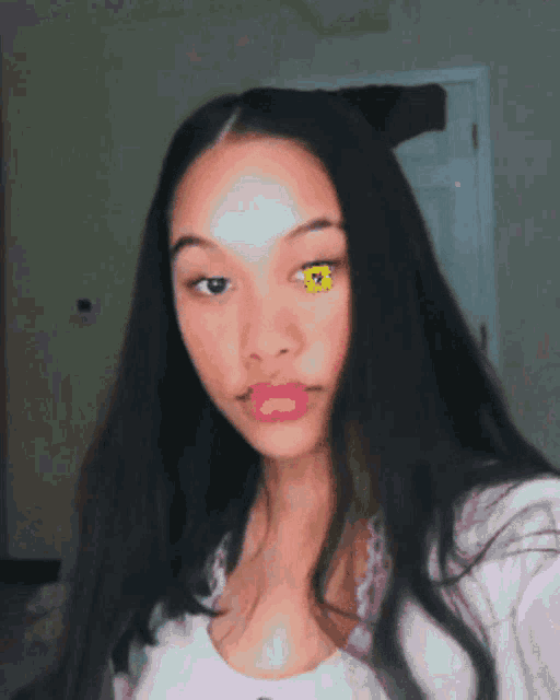 a woman with a yellow flower on her eye