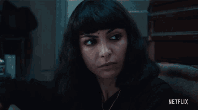 a close up of a woman with a netflix logo on the bottom