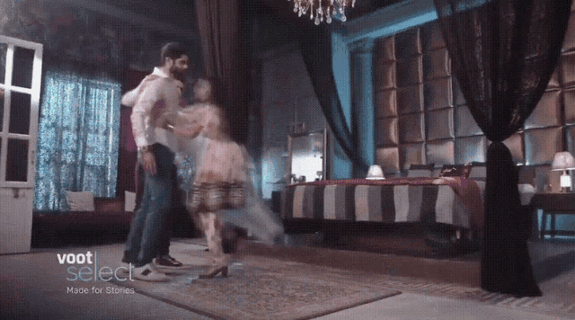a man and woman are dancing in a room with the words voot select made for stories