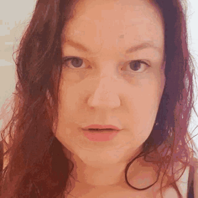 a close up of a woman 's face shows her eyes and mouth
