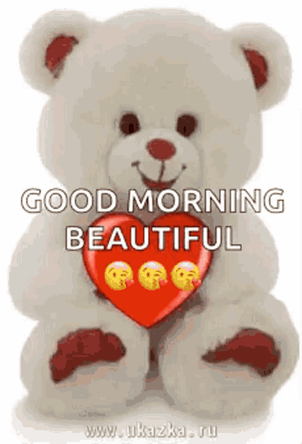 a teddy bear is holding a red heart with smiley faces on it and says `` good morning beautiful '' .
