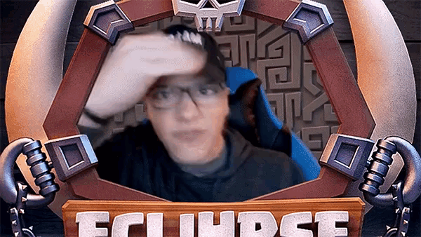 a man with glasses is sitting in front of a sign that says ecli judge