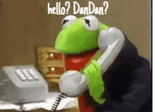 kermit the frog is talking on a telephone and says hello dandan .