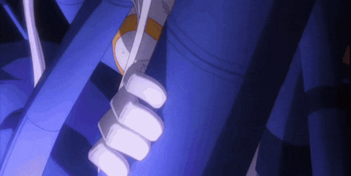 a person 's hand is holding a blue object that says ' ls ' on it