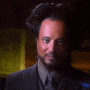 a man in a suit and tie is making a funny face and saying aliens !