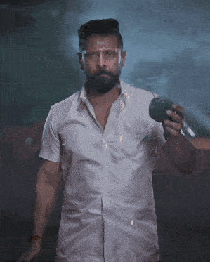 a man in a white shirt is holding a lighter