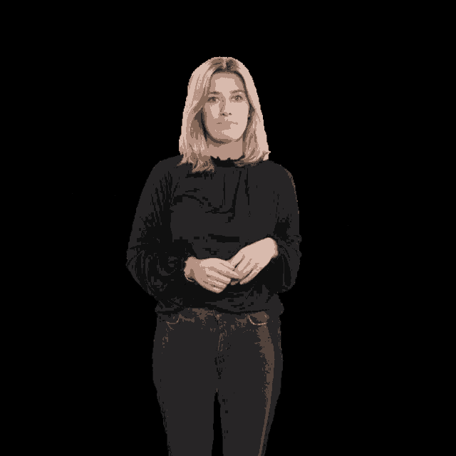 a woman in a black shirt is shrugging her shoulders and making a funny face