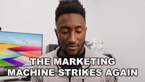 a man says " the marketing machine strikes again " in front of a television