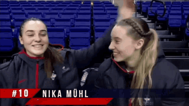 a video of two girls with # 10 nika mühl written on the bottom