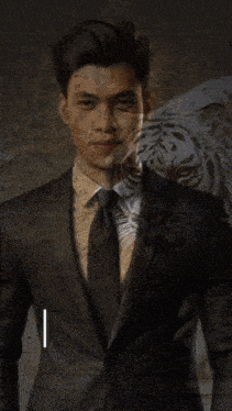a man in a suit and tie stands in front of a tiger with panglima jorda written on the bottom