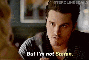 a man in a striped shirt is talking to a woman and saying `` but i 'm not stefan . ''