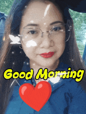 a woman wearing glasses and red lipstick says good morning with a heart in front of her