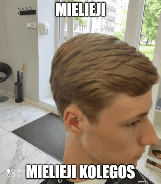 a man getting his hair cut in a salon with a caption that says mieleji mieleji kolegos