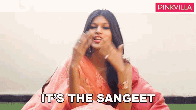 a woman in a pink saree says it 's the sangeet