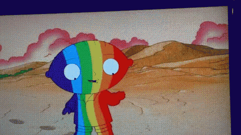 a cartoon character with a rainbow colored shirt on