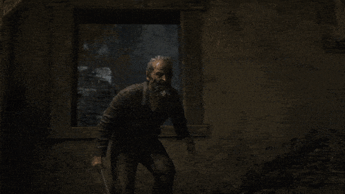 a man in a black shirt is walking next to another man