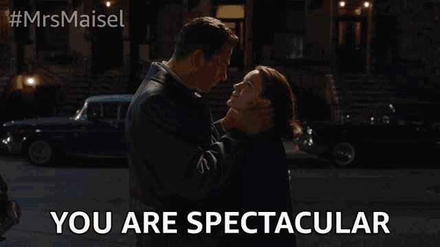 a man and a woman are hugging with the words you are spectacular below them