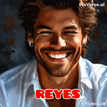 a man with a beard is smiling and the name reyes is on the bottom right