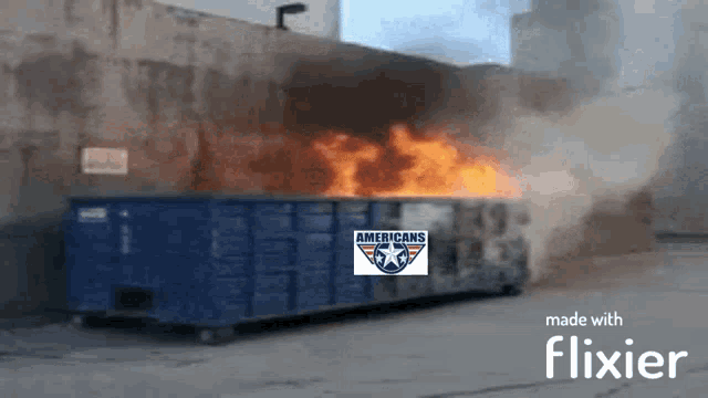 a dumpster is on fire with a sign that says americans on it
