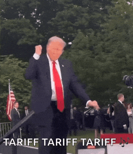 a man in a suit and tie is dancing with the words tariff tariff tariff written on the bottom .