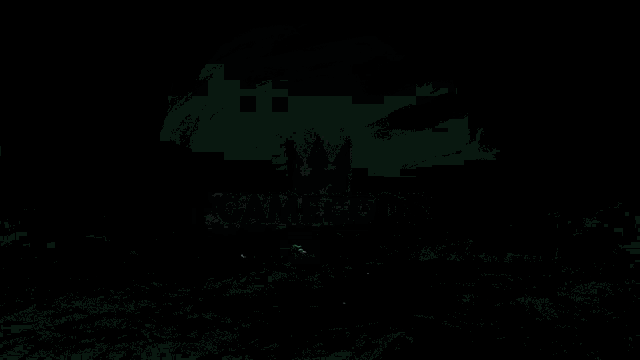 a green glowing object is floating in a dark area