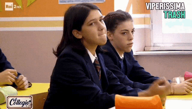 two girls sit in a classroom with the words viperissima trash on the bottom