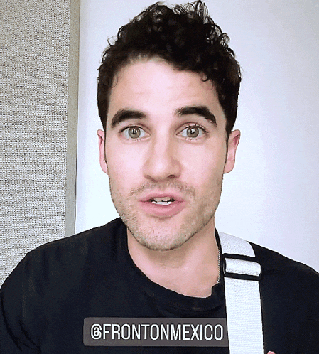 a close up of a man 's face with a sticker that says frontonmexico on it