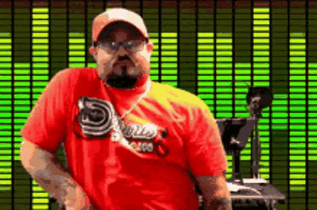 a man wearing a red shirt that says ' snoop dogg ' on it